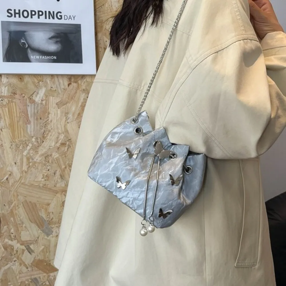 PU Drawstring Bucket Bag Pearl Pendant Metal Butterfly Accent Chain Crossbody Bag Minimalist Design Lightweight Shoulder Bag