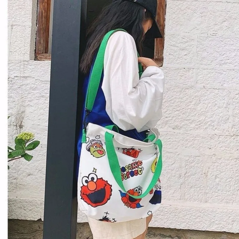 Sesame Street animation peripheral cartoon cute student large capacity canvas tote bag creative personalized crossbody handbag