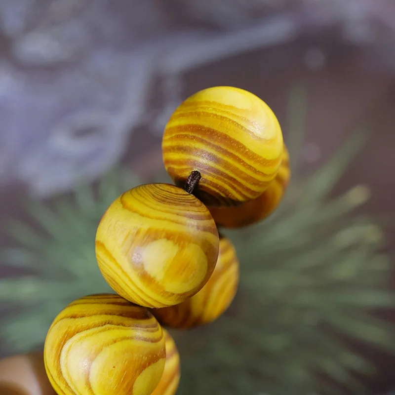 Amber wood core cross-eye carving with ghost face pattern, collectible wooden prayer beads, unisex hand-carved bracelet