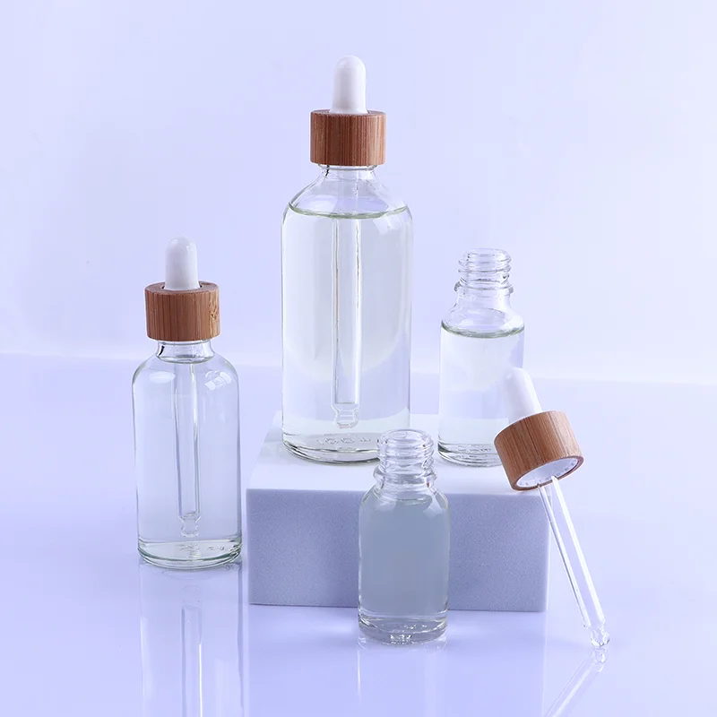 

10ml and 50ml Cleear Round Shoulder Glass Bottle with Bmaboo Dropper Cap Products Bottling Container Refillable Bottle Pot