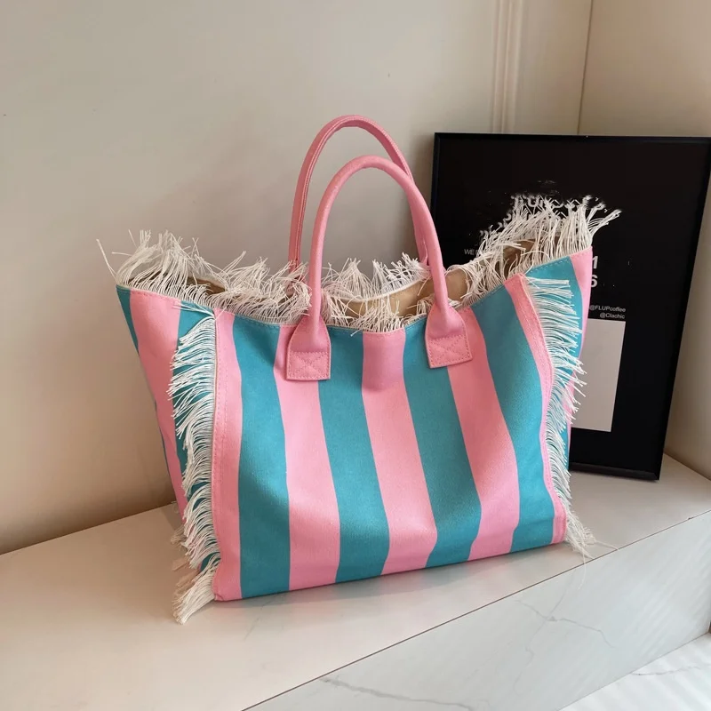 

Women's shoulder bag fashion senior sense canvas tote bag large capacity small design bag fringe hand shoulder bag
