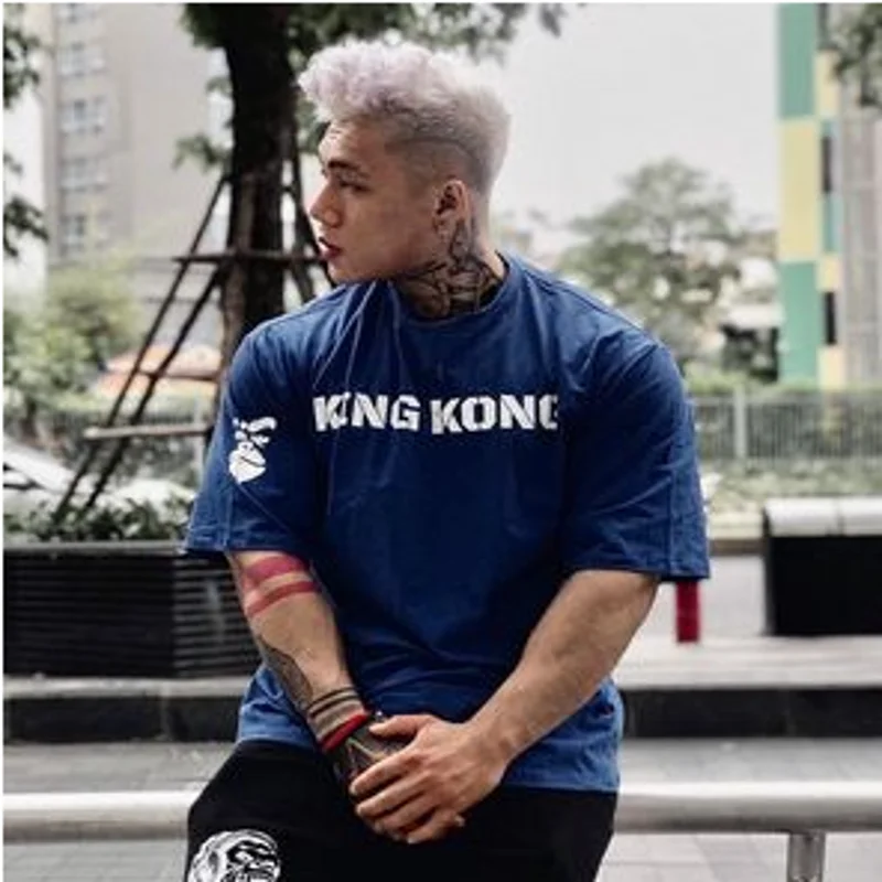 T-shirt sportiva a maniche corte da uomo alla moda con vestibilità ampia per abbigliamento da allenamento da corsa da palestra a mezza manica in