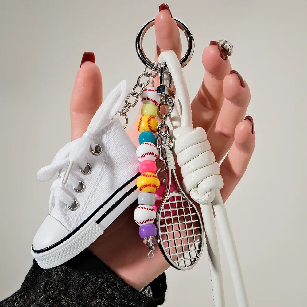

Mini canvas shoes with niche personality, cherry key pendant, sports style tennis bead bag pendant, mobile phone hanging chain