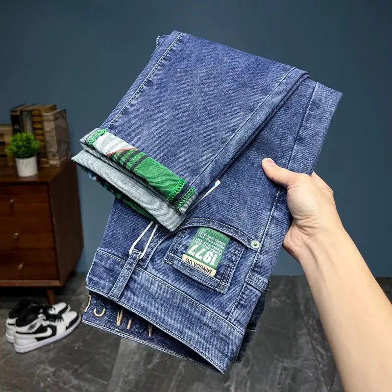 الاتجاه الأصلي الربيع والصيف رقيقة الرجال سليم المناسب مطاطا الراقية السراويل الجينز أقدام صغيرة جديد طويل العلامة التجارية الشارع الشهير السراويل