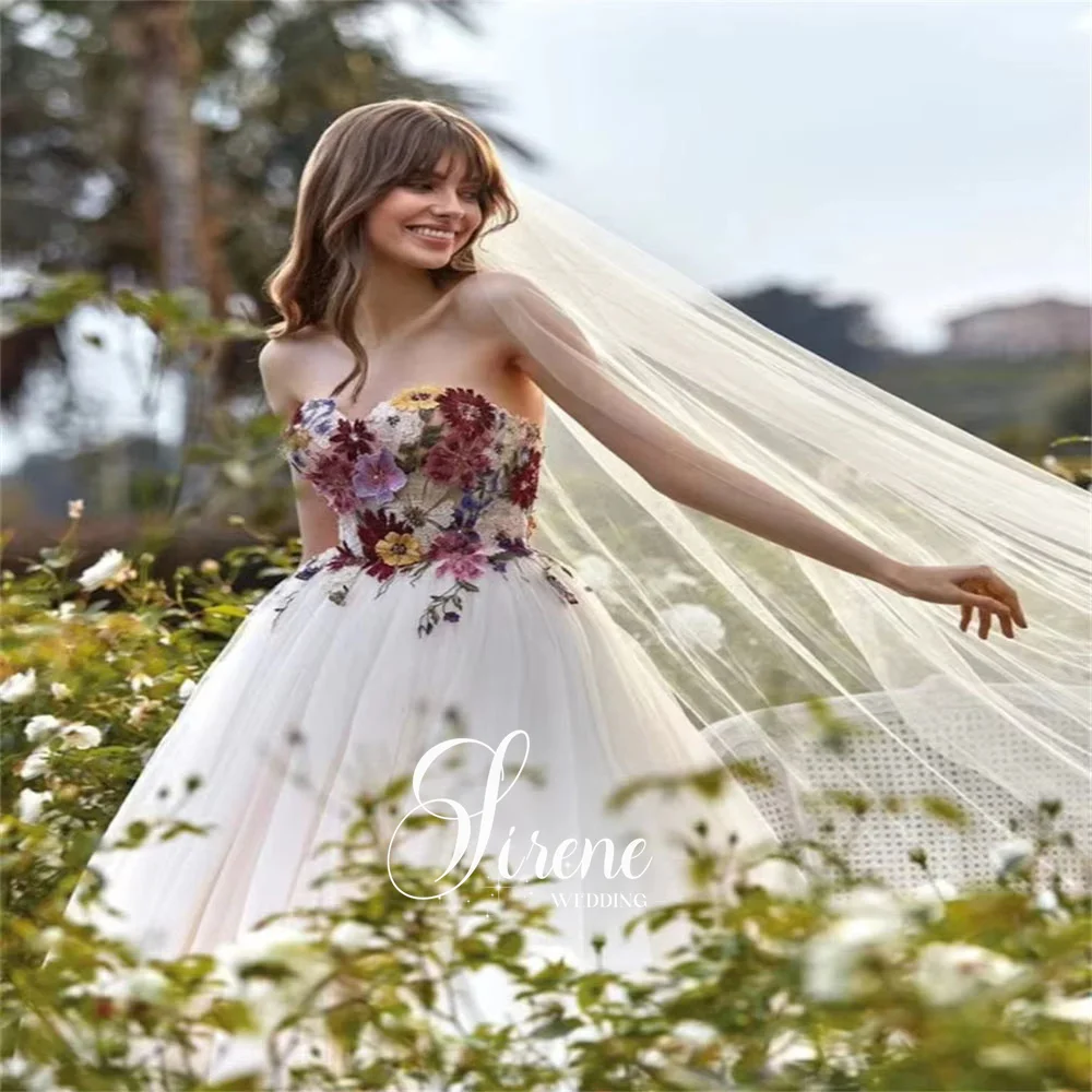 فساتين زفاف سيرين على شكل قلب بدون أكمام على شكل حرف a من التل والزهور بدون حمالات مزينة بطول الأرض بدون ظهر فستان حفلة موسيقية مخصص