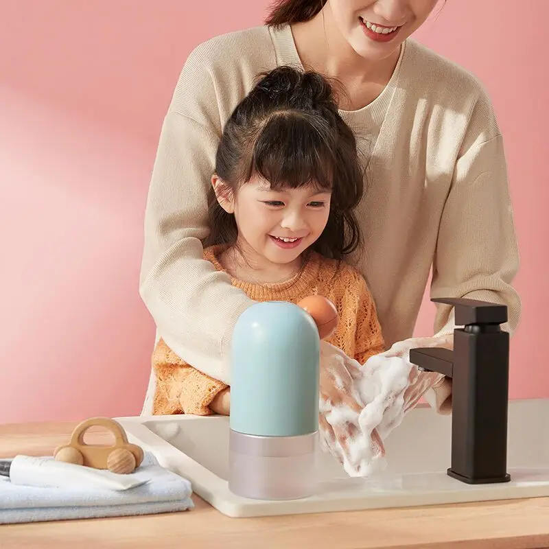 หมีเซนเซอร์อัตโนมัติสำหรับเจลทำความสะอาดมือสมาร์ทโฟมเครื่องซักผ้าโทรศัพท์มือถือเครื่องจ่ายสบู่เหลวในครัวเรือนใหม่ที่น่ารักสำหรับเด็กบ้าน