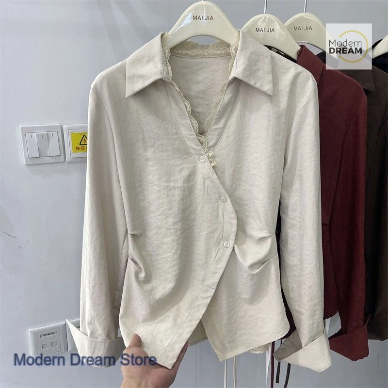 Camicia di nicchia senso design in stile francese da donna primavera e autunno nuova moda top a maniche lunghe sottile con cintura irregolare