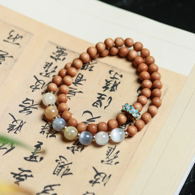 

Natural Barbie sandalwood bracelet, fashionable cultural and playful double loop bracelet, artistic Buddha bead jewelry