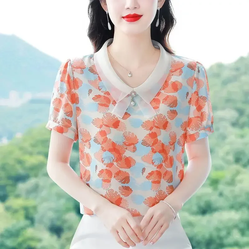 

2024 New Summer Korean Version Fashionable and Elegant Short Sleeved Blouse Loose Doll Neck Printed Patchwork Women's Shirt Top