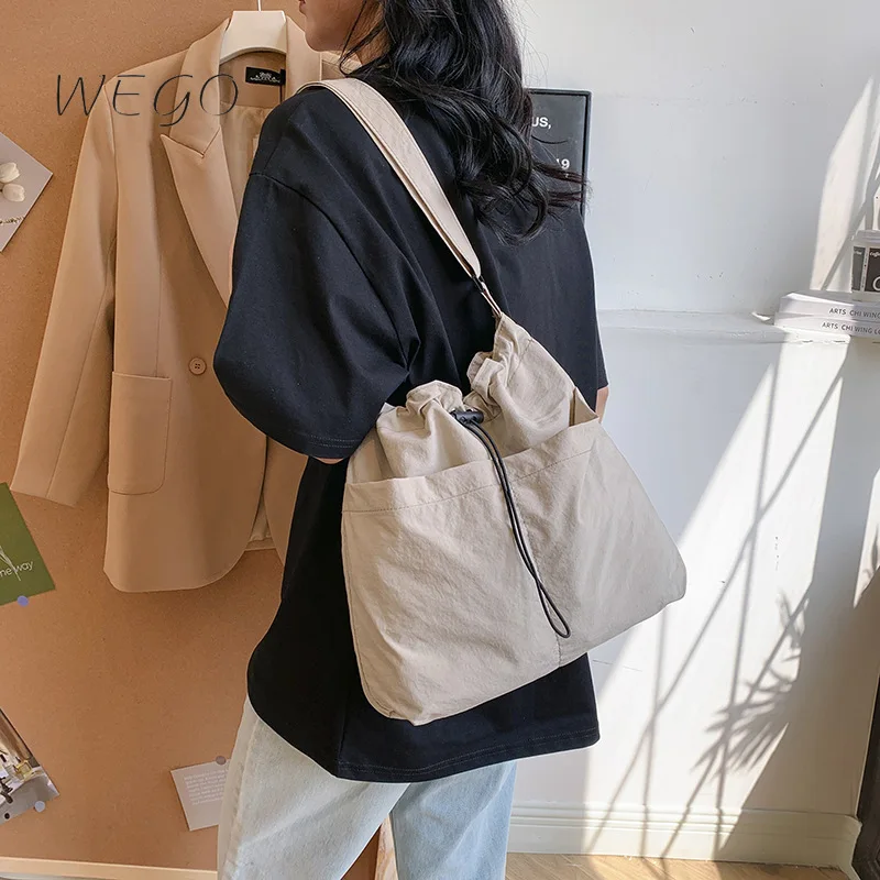 

2024 New Bucket Bag Japanese Ins Leisure Messenger Large-capacity Drawstring Bucket Bag Women's Street One-shoulder Commuter Bag