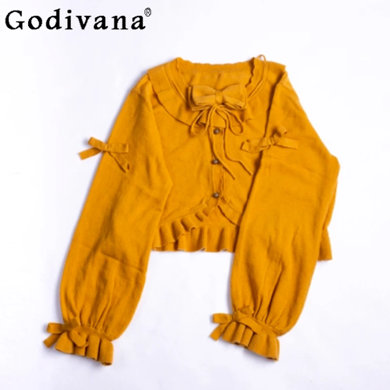 

Весенне-осенний новый милый свитер в стиле Лолиты с бантом, пальто, модный вязаный топ с куркумой и нерегулярными оборками, милый вязаный топ на шнуровке