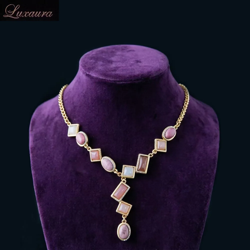 

Vintage jewelry featuring a fashionable and classic pink geometric necklace design paired with Bohemian style women's necklace