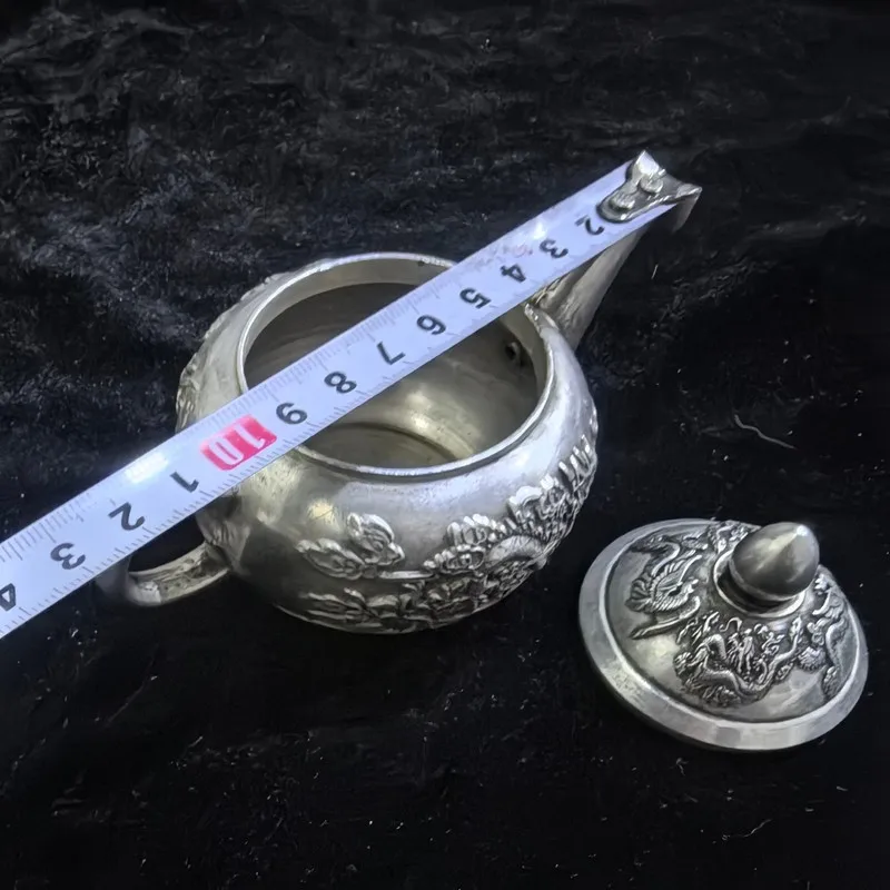 Antique-style Qing Dynasty Qianlong-era and phoenix pot, copper with silver plating, featuring a relief carving of dragon