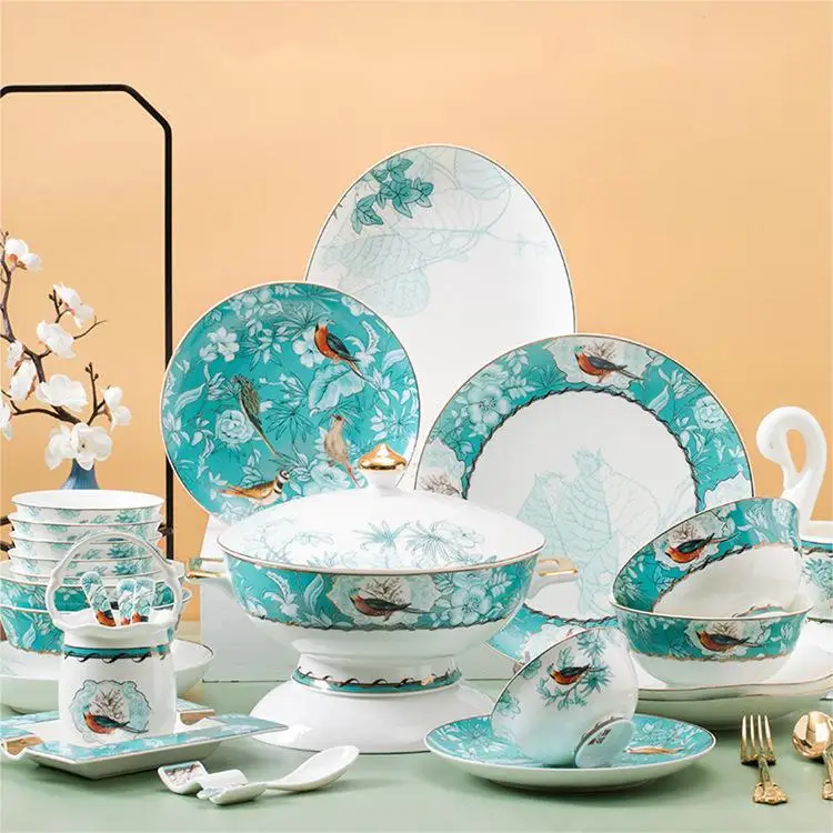 

Jingdezhen bone china tableware and dishes set with gold painted bowls, plates and chopsticks as a housewarming gift