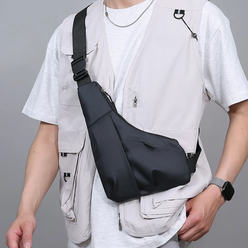 

New men's light close triangle bag simple leather membrane texture shoulder crossbody bag tide cool leisure portable chest bags
