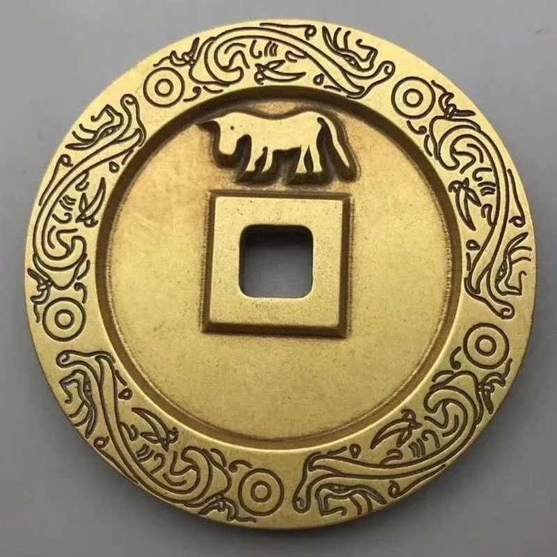 Brass heirloom with engraved floral patterns, collectible coin, antique craft item
