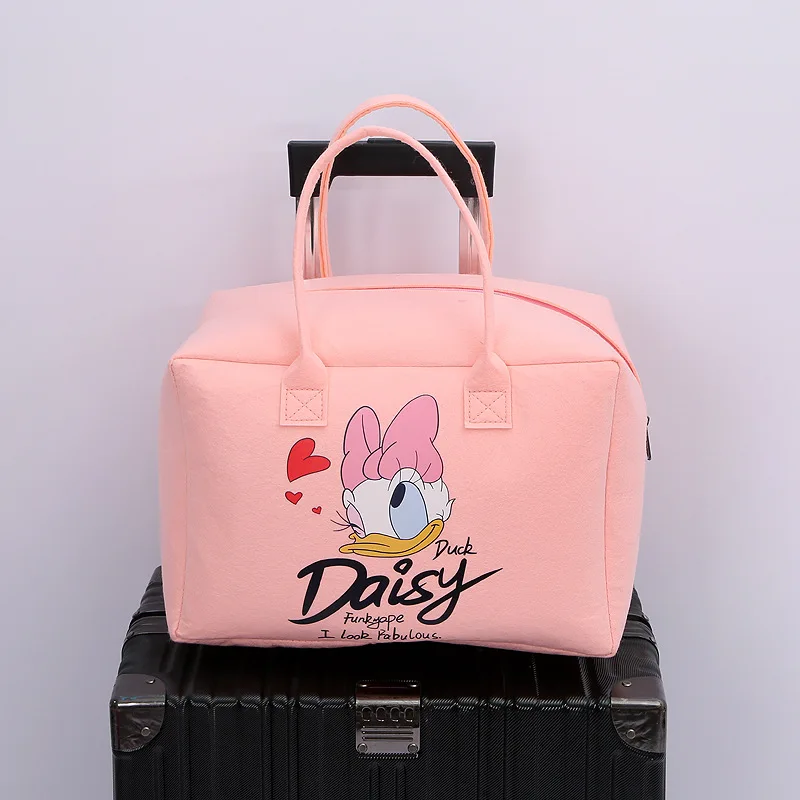 Neue Mickey Mouse Damen handtasche Disney Cartoon Muster Minnie Donald Ente tragbare große Kapazität Filz Reisetasche Mädchen Einkaufstasche