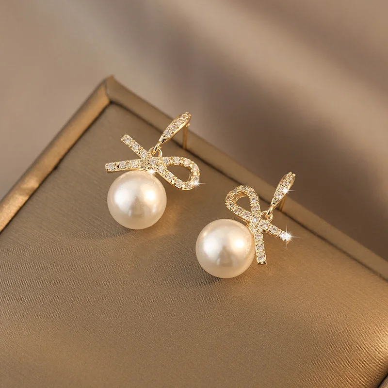 

*Bow shaped pearl earrings with versatile temperament, summer earrings, niche, light luxury, and high-end earrings