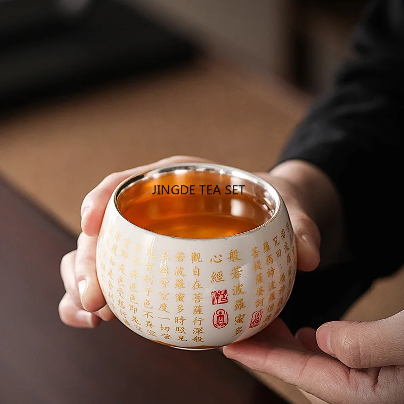 

Yangzhi Jade Ceramic Silver Plated Single Master Cup White Porcelain Gold Plated Heart Sutra Kung Fu Tea Cup 170ML