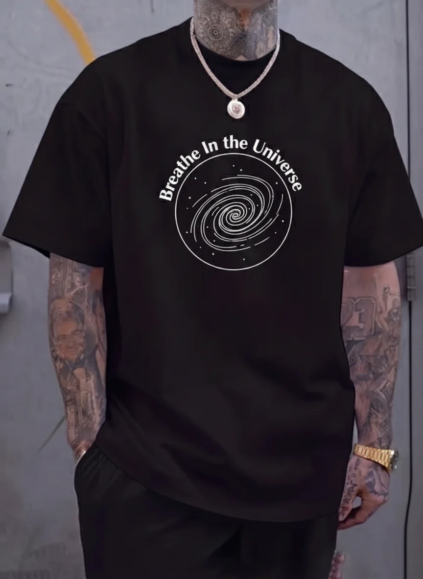 

Black Galaxy Graphic Tee with White Spiral Planet Print Breathe in the Universe Casual Printed Tee Unisex Top Streetwear Style