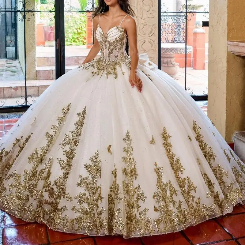 

Luxury Beige Shiny Quinceanera Dresses Gold Lace Appliqued Lace Bow Beading Crystal Spaghetti Strap Ball Gown Sweet 16customized