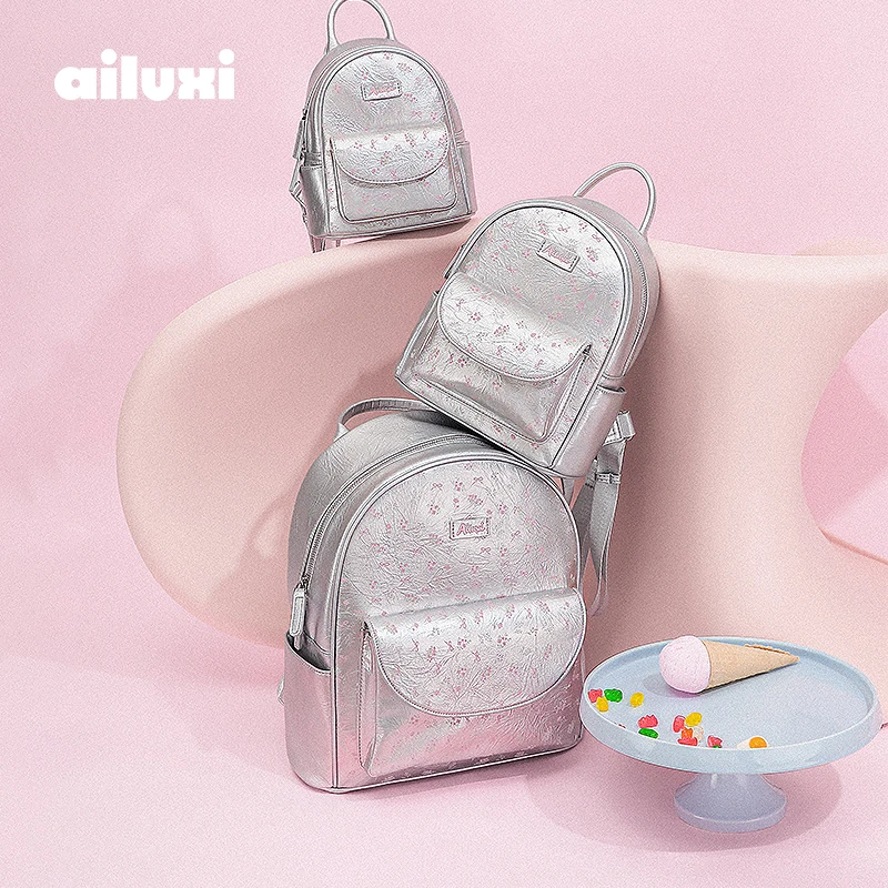 

Серебряный рюкзак AILUXI для девочек, подарок на день рождения, 2025 г., оригинальная нишевая дизайнерская дорожная легкая сумка из искусственной кожи, женская сумка