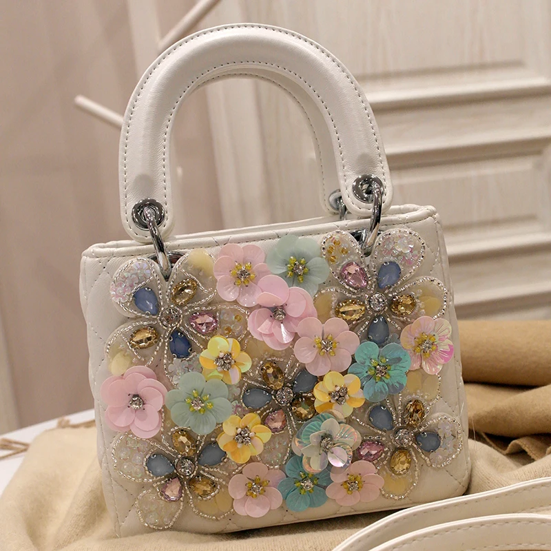 

spring new fashion women's bag niche fashion foreign heavy industry flowers hand bill of lading shoulder crossbody small bag