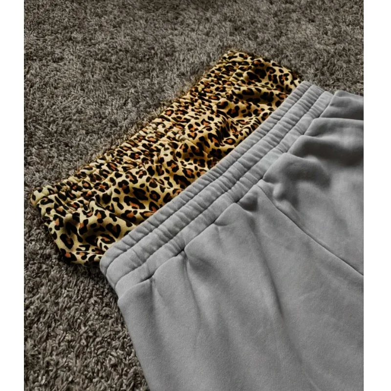 Pantaloni a gamba larga da uomo a vita alta a doppia vita casual a maniche lunghe con stampa leopardata a contrasto moda invernale
