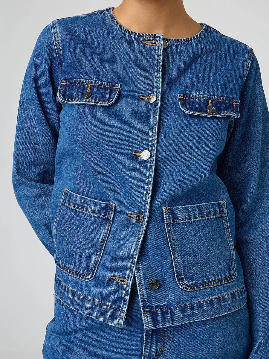 

Ladies Classic Blue Denim Jacket with Round Neckline Long Sleeves and Fit Button Down Design - Stylish Jean Coat