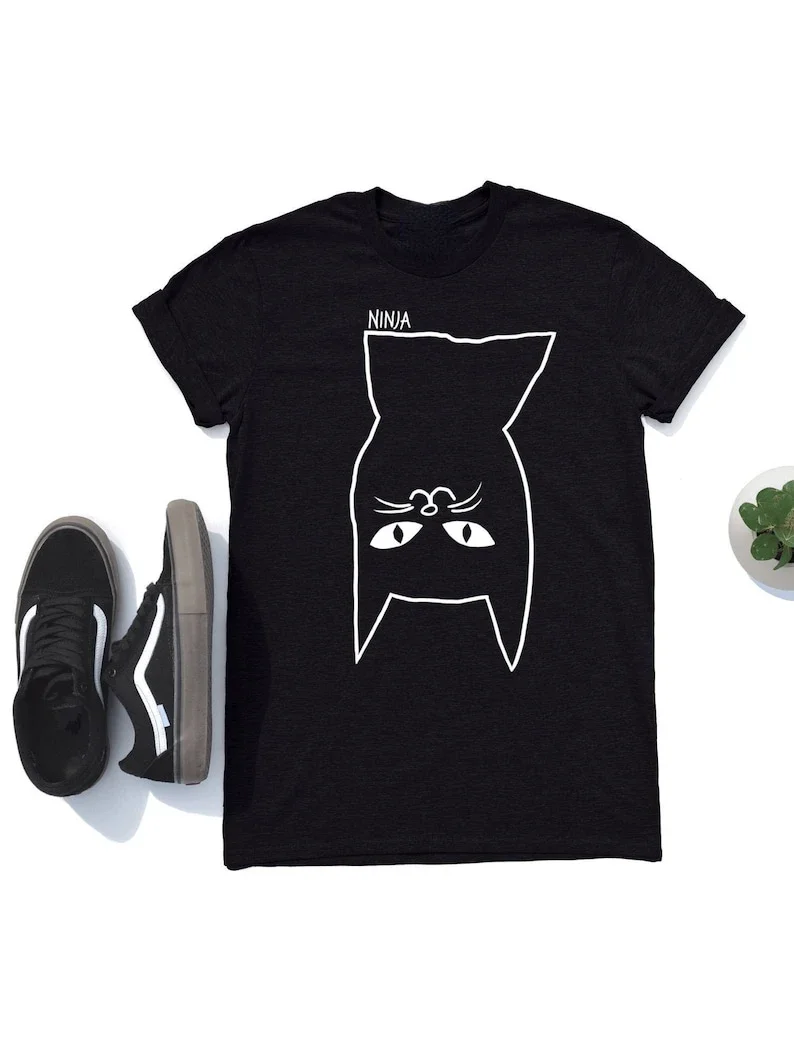 Ninja Cat Has Landed, This Super Soft Unisex  Tshirt Is Available in Two Colours with Worldwide Shipping  All-match Unique