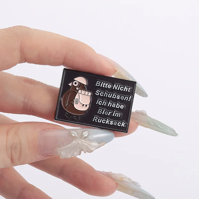 Schubsen: Humorvolle Anstecknadeln für jeden Anlass