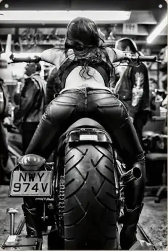 MOTORCYCLE METAL TIN SIGN SEXY PIN UP ON MOTORCYCLE SHOWING BEHIND FAT TIRE sign
