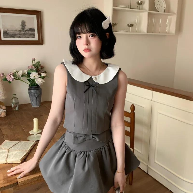 Korean Vintage Harajuku Gold Feeling Sweet Doll Collar Vest Top Temperament Bow Half Skirt Street Shot Ins Two-piece Set 니트 스커트