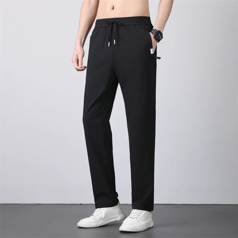 رقيقة تنفس السراويل الرجال 7XL الحرير الجليد الصيف التجفيف السريع فضفاض مستقيم مرونة عالية السراويل الرياضية الركض سراويل تقليدية