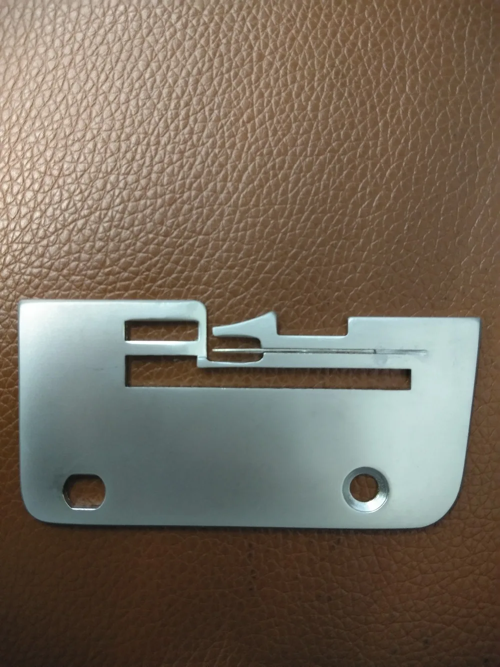 

JANOME (NEWHOME) SERGER ROLLHEM NEEDLE PLATE PART#785609009