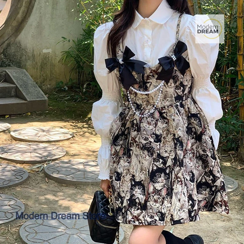 Abito estivo abito femminile francese design di nicchia senso camicia con maniche a palloncino top fiocco pittura a olio gonna con reggicalze retrò abito a due pezzi