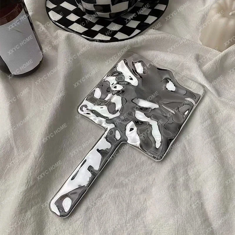 Hand held vanity mirror