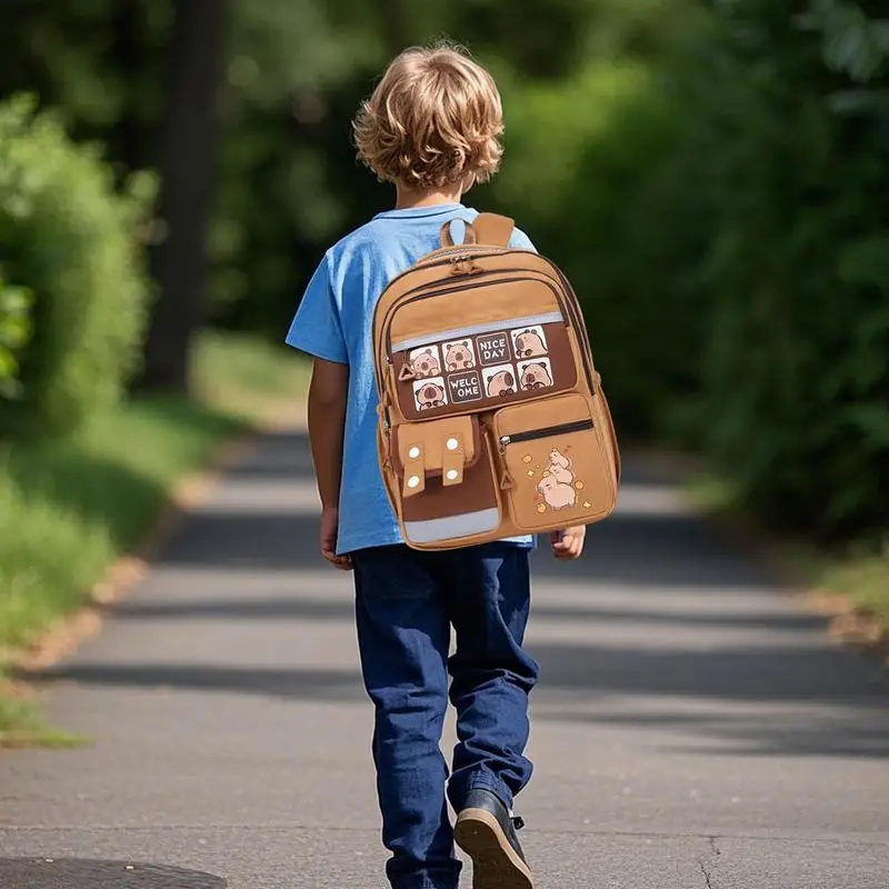 Kapibara กระเป๋าเป้สะพายหลังนักเรียนชั้นประถมศึกษาการ์ตูนความจุขนาดใหญ่กระเป๋าเป้สะพายหลังป้องกันสกปรก Capybara กระเป๋าเป้สะพายหลัง