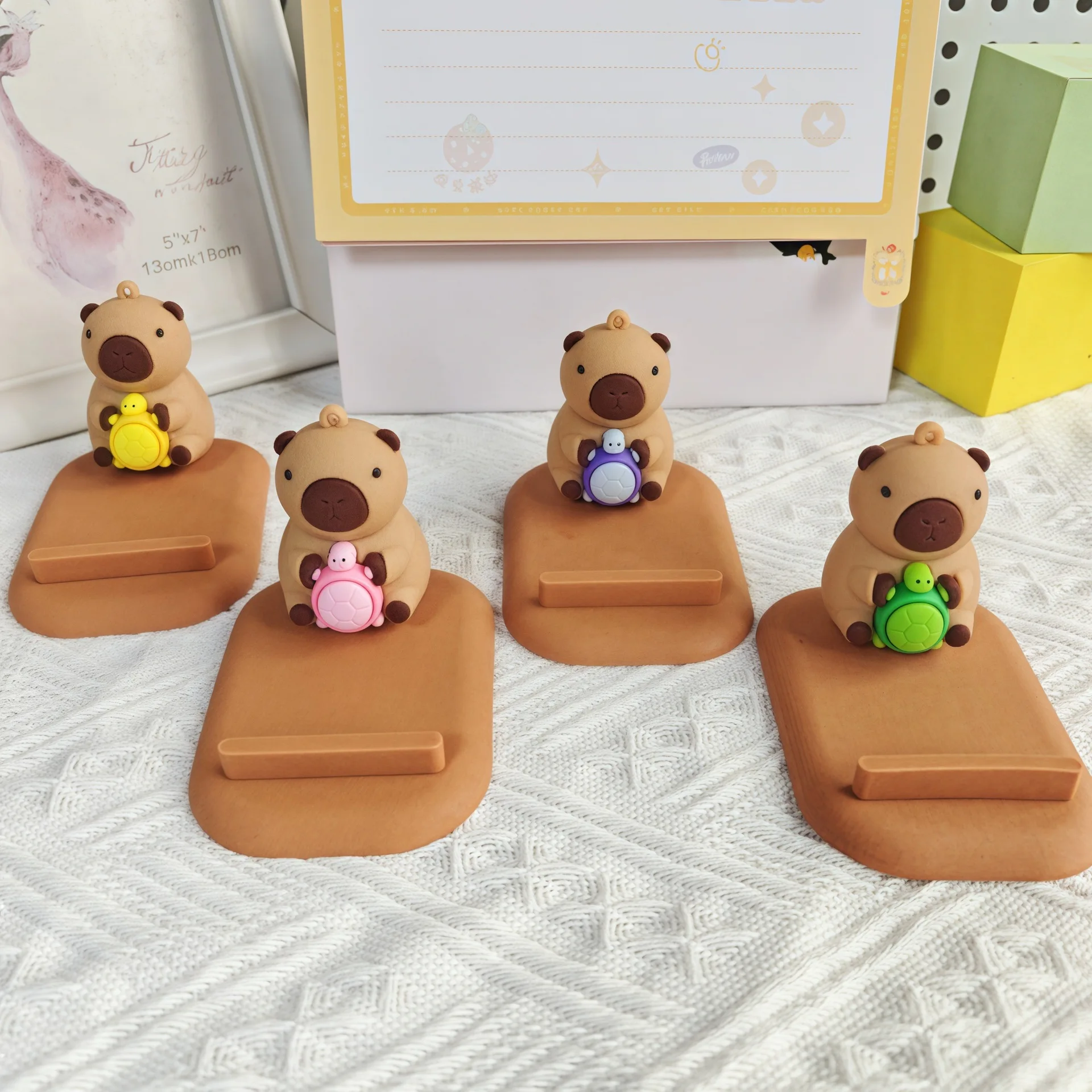 

New Creative Cross Border Capibala Desktop Bedhead Lazy Phone Tablet Stand For iPhone 17 16 Doll Machine Phone Stand Holder