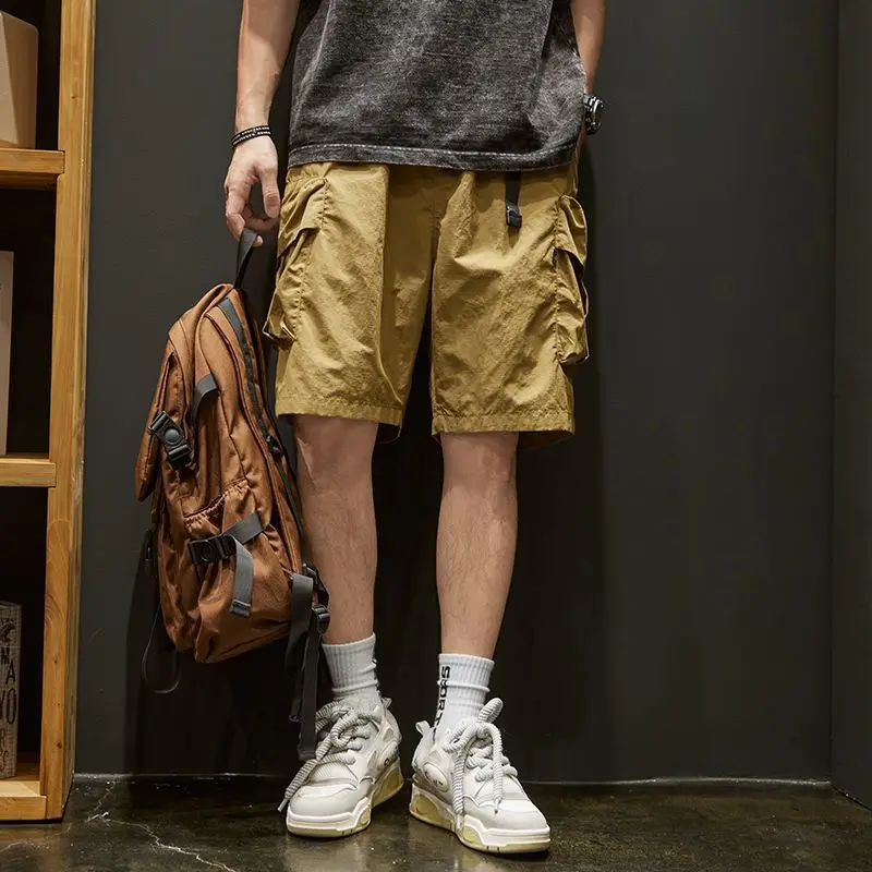 Pantalones cortos Cargo multibolsillos para hombre, cintura elástica, sólidos, pantalones cortos para hombre, pantalones cortos negros de diseñador, ropa de calle ancha y cómoda de nailon