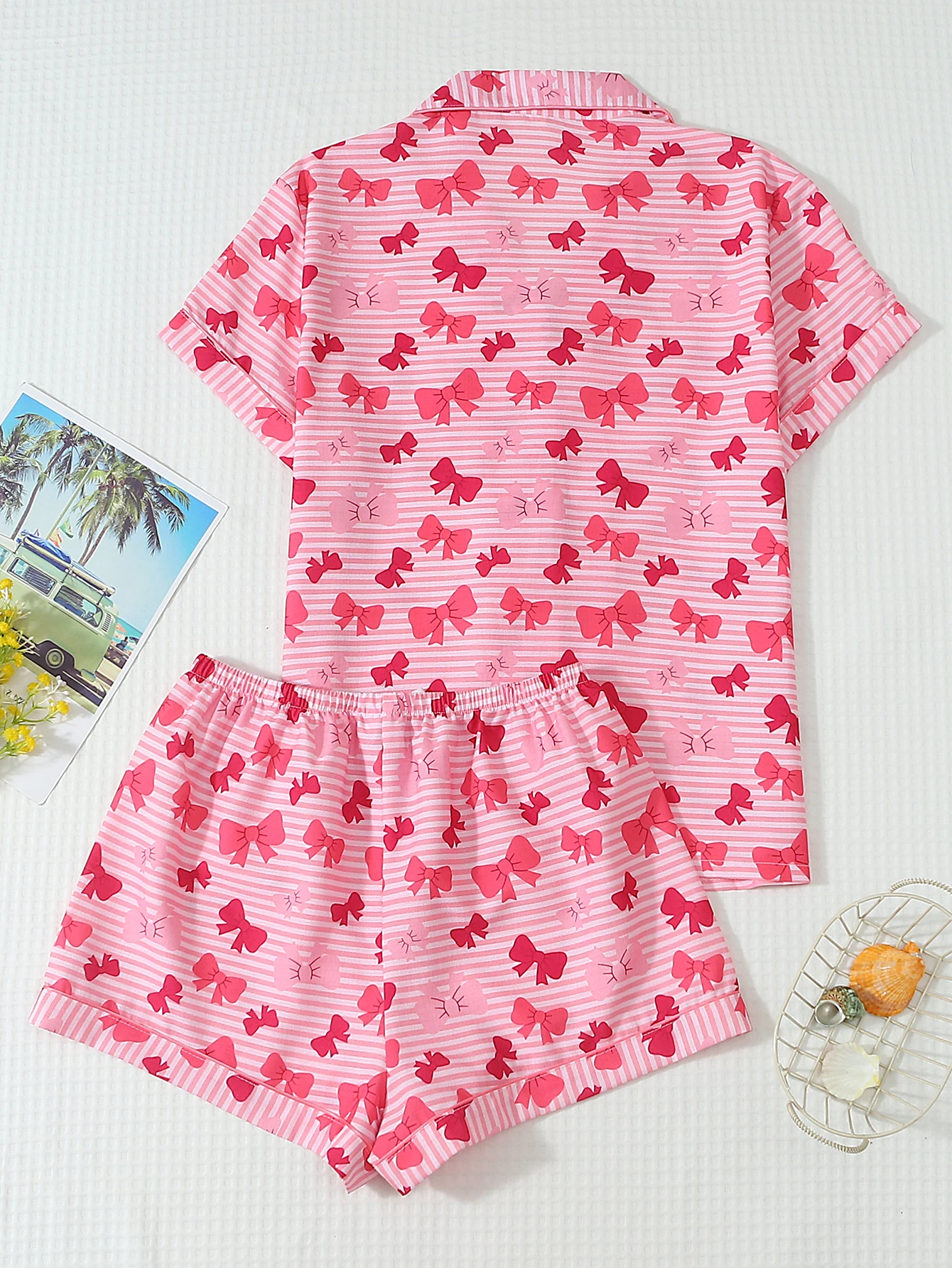 Two-Piece Set: Comfortable Pink and White Striped Top with Red Bow Print, Turn-Down Collar, Buttoned Short Sleeves, and Pockets, Paired with Bow Shorts. Spring/Summer Women's Pajama Loungewear Set Suitable for Home Use