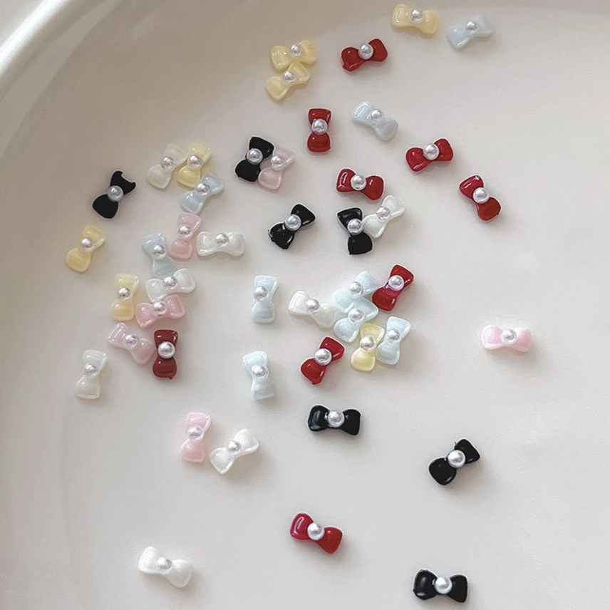 رائعة الفرنسية أنيقة Bowknot اللؤلؤ ربطة القوس فيونكة لطيف الراتنج الشريط سحر الحلو مسمار الفن زينة مانيكير اكسسوارات بالجملة