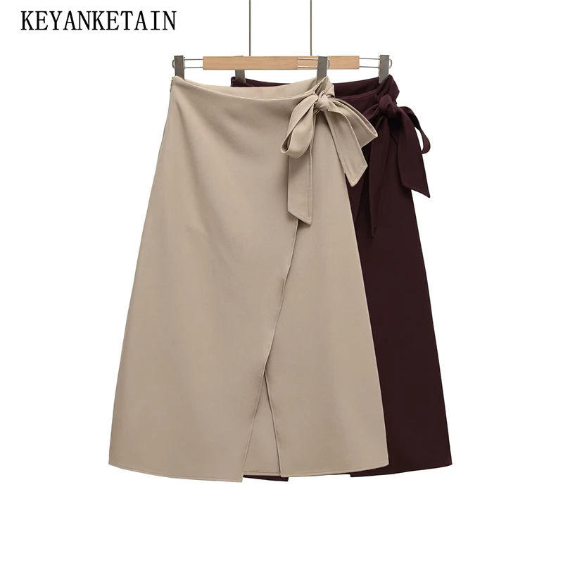 

KEYANKETIAN 2025 Summer New Bow Lace Up High Waist Side Zipper Asymmetrical MIDI Skirt Women's Solid color Split A Line Skirt
