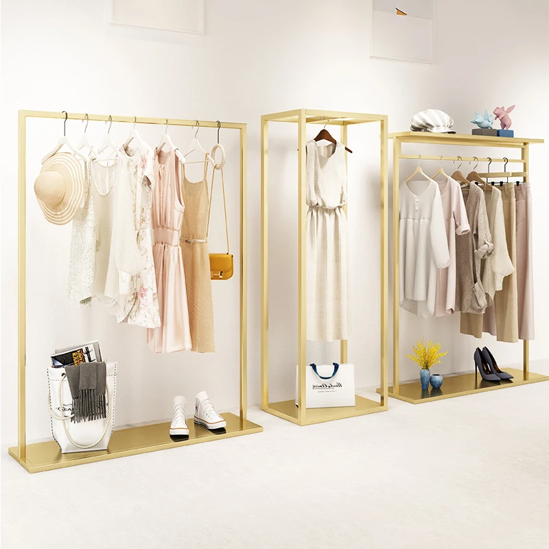 custom.High Class Custom Luxury Stainless Steel Golden Rail Garment Store Furniture Haing Clothes Display Rack