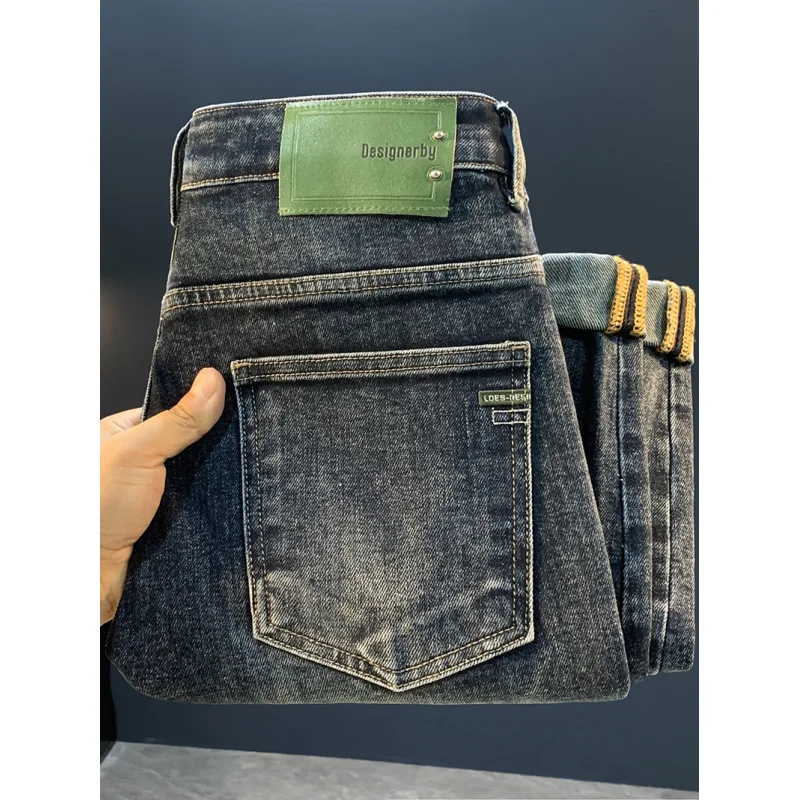 2025 جديد مايكرو هارين ثقب الجينز للرجال موضة الخريف الاتجاه ، مخروطي القدم الصغيرة السراويل المرنة غير رسمية