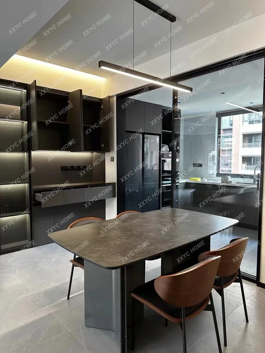 A  minimalist modern black rock slab dining table rectangular retro wabi-sabi style