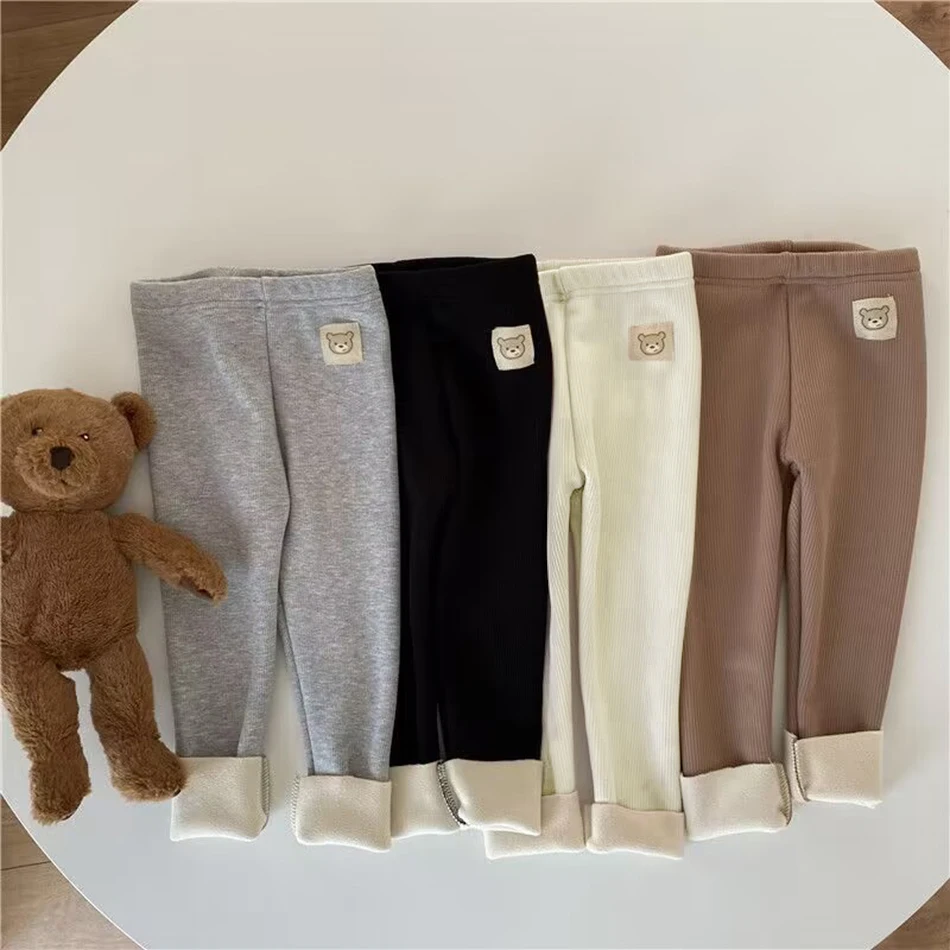 Coreano Otoño Invierno nuevos niños Leggings de una pieza Unisex niños niñas bebé frío evitar caliente dibujos animados elásticos pies atados pantalones