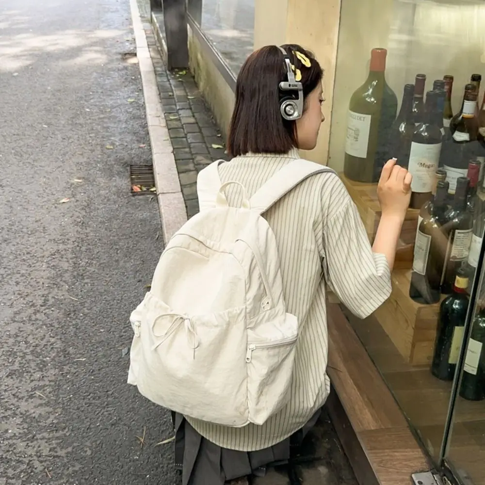 

New Design Bow Wrinkle Backpack Sweet Solid Color Nylon Lightweight Backpack Korean Style Large Capacity Travel Shoulders Bag