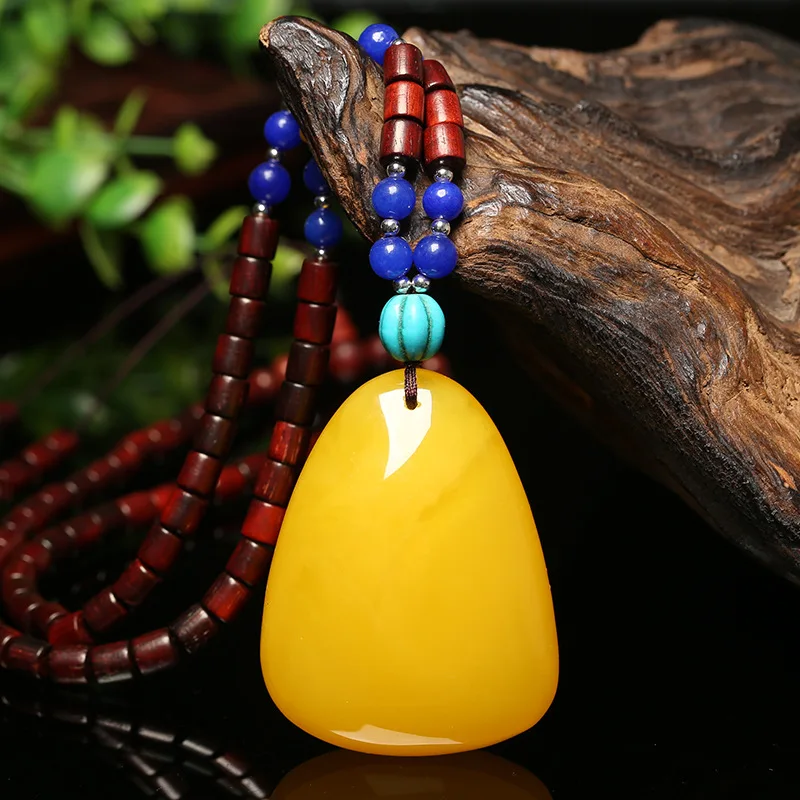 

One Piece Dropshipping Chicken Oil Yellow Old Amber Pendant Necklace for Women, Amber Necklace with Water Drop Shape, Sweater Ch