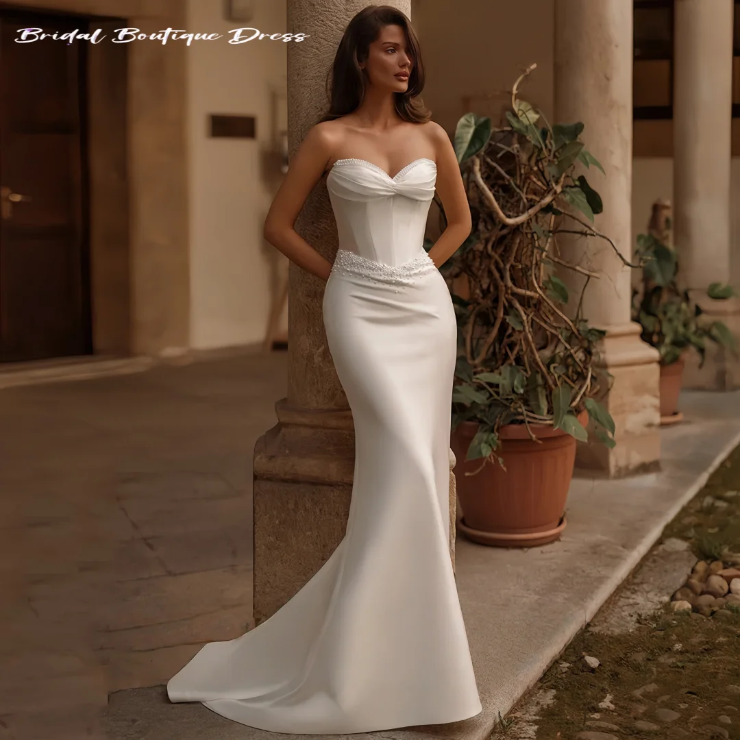 Vestido de novia elegante personalizado con perlas, escote en forma de corazón, sin mangas, cola de barrido, vestido de novia Sexy de sirena con tren desmontable